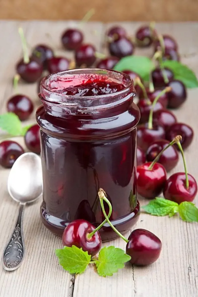 Cherry jam jar with fresh cherries