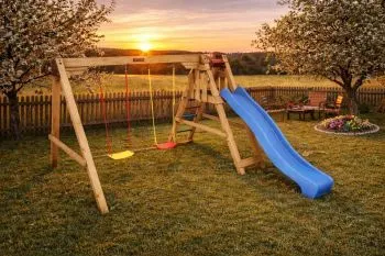 Playset with slide and swings